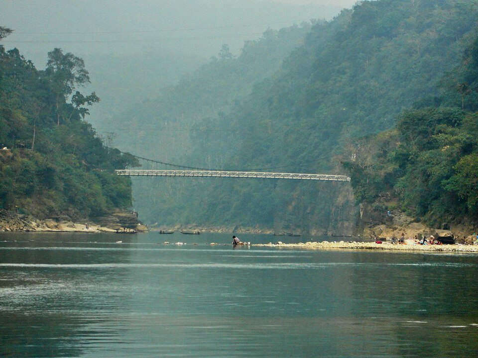 Jaflong Zero Point on the Piyain River, Sylhet, Bangladesh — clear mountain water over smooth boulders
