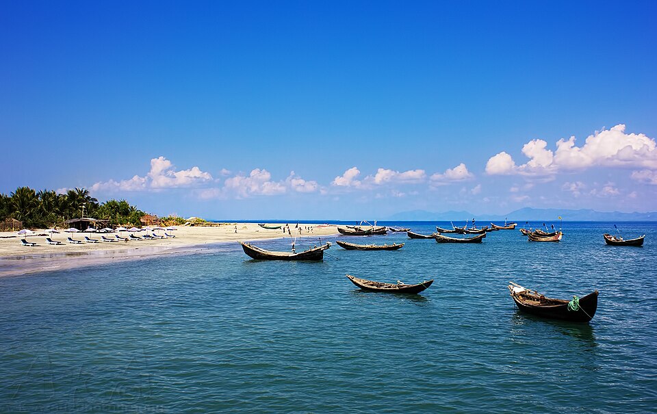 Fishing boats on crystal-blue water at Saint Martin's Island, Bangladesh — the country's only coral island